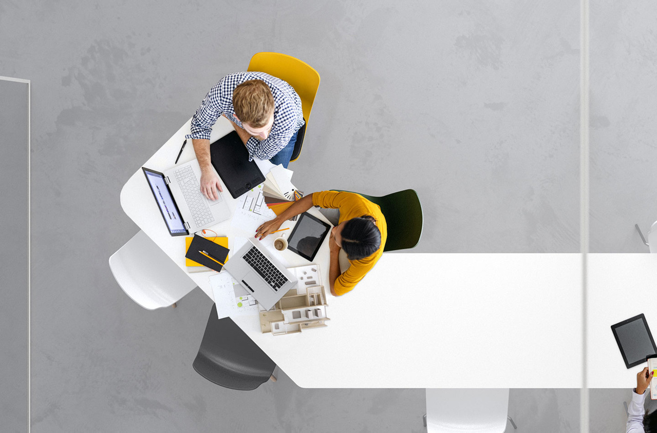 Co-workers at desk working